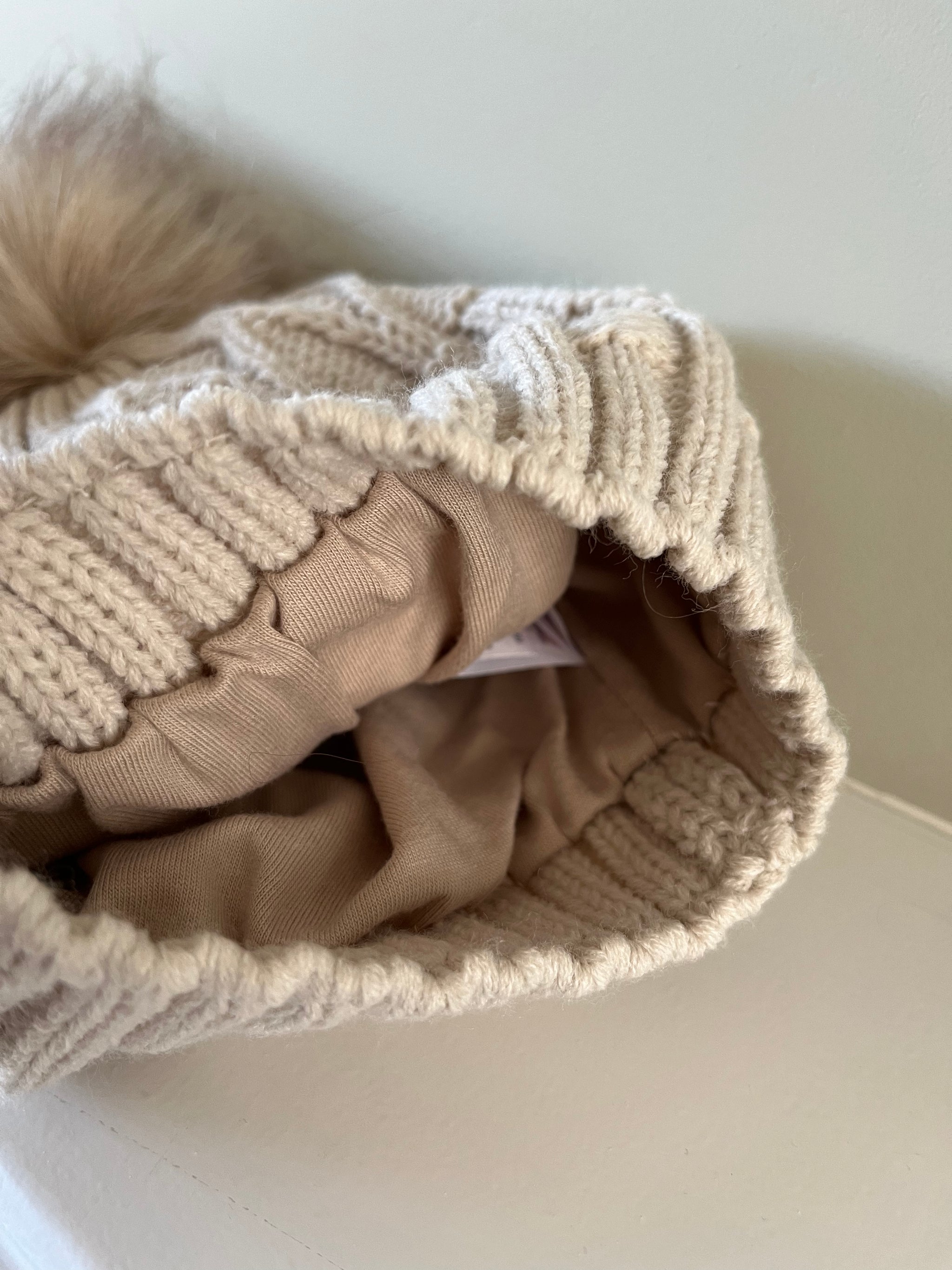 Biscuit Beige Knitted hat with Faux Fur Pom